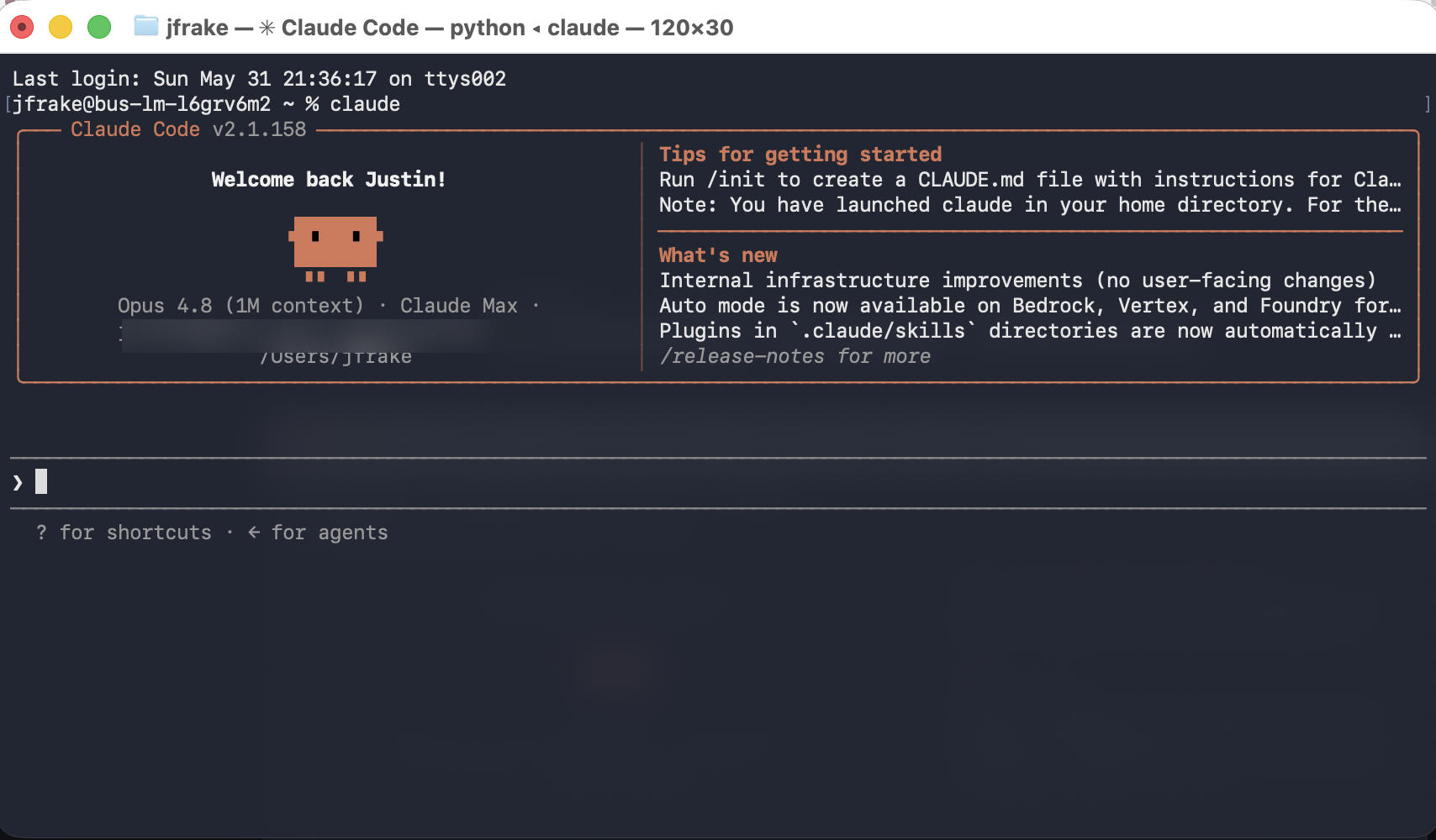 Claude Code v2.1 terminal welcome screen showing the model, organization, and the prompt input.